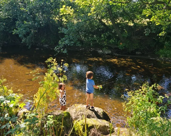 Riverbend children fishing in the river